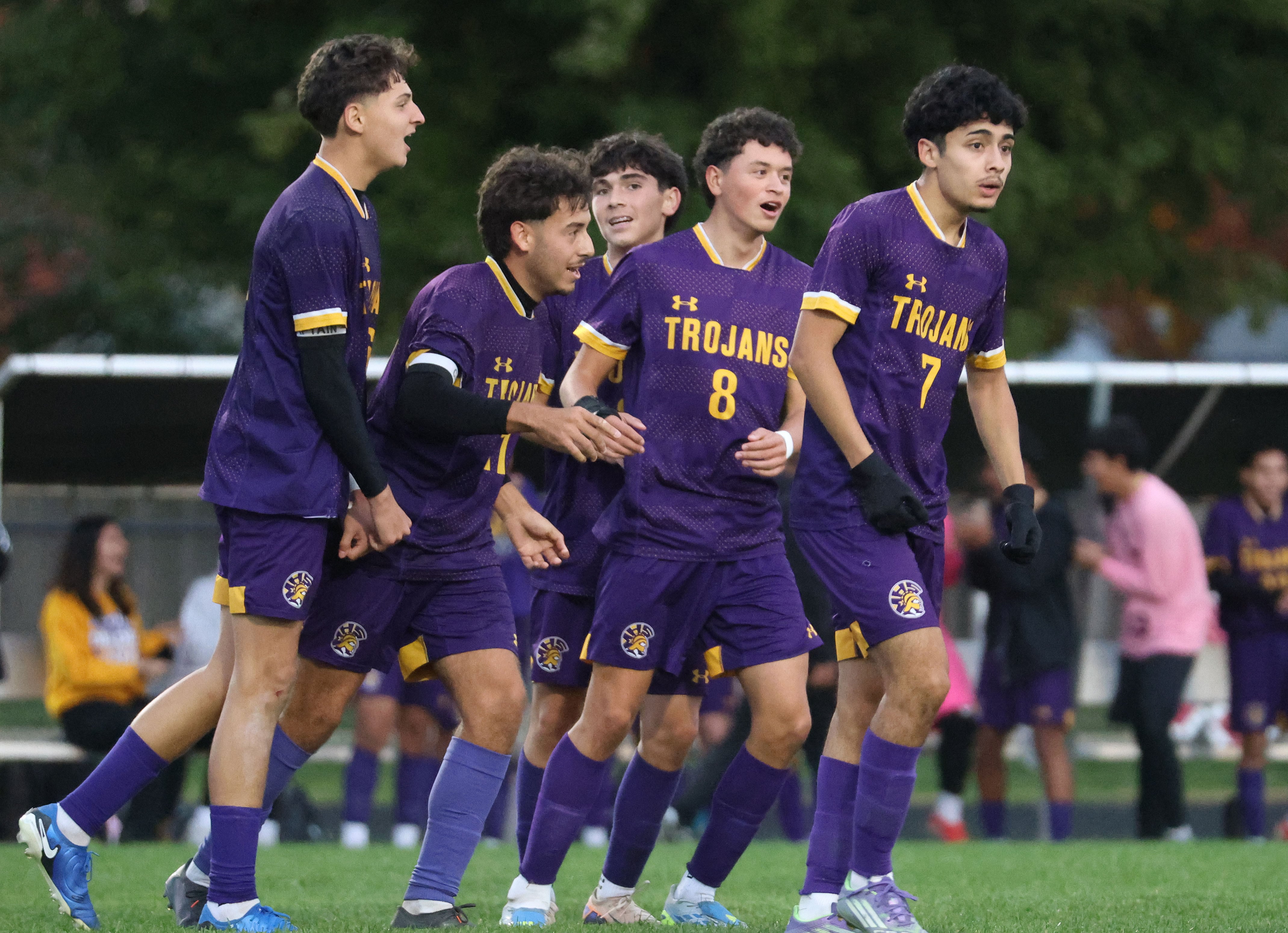 Mendota boys soccer team celebrating a goal during a high school match